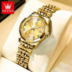 Foto original del reloj OLEVS 9970 dorado sobre cojín, con fecha a las 3 y pulsera de acero