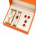 Set de lujo para mujer con reloj dorado, pulsera, aros, colgante y anillo rojo